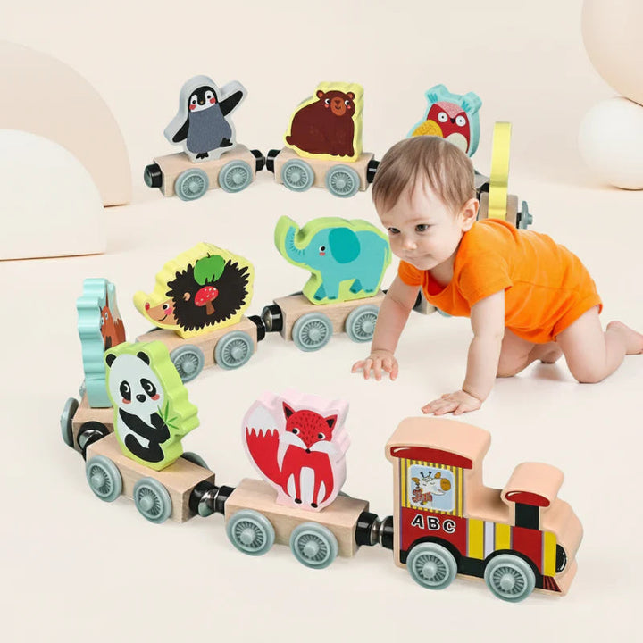 Wooden magnetic train with animal cars shown beside a child in an orange shirt