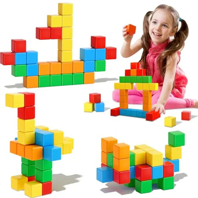 Child playing with colorful magnetic cube builds, including a boat, arch and animal shapes
