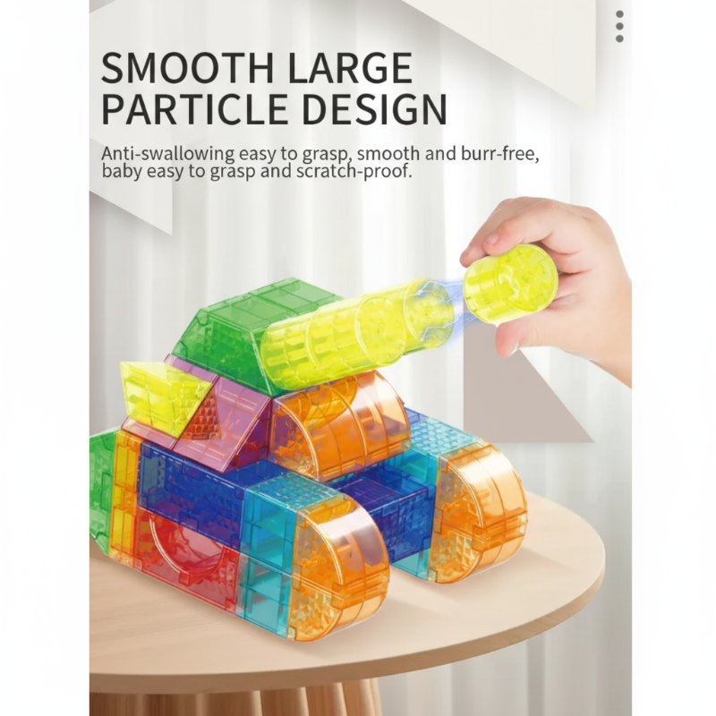 Hand holding a yellow cylindrical piece beside a magnetic block vehicle.