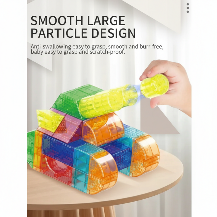 Hand holding a yellow cylindrical piece beside a magnetic block vehicle.