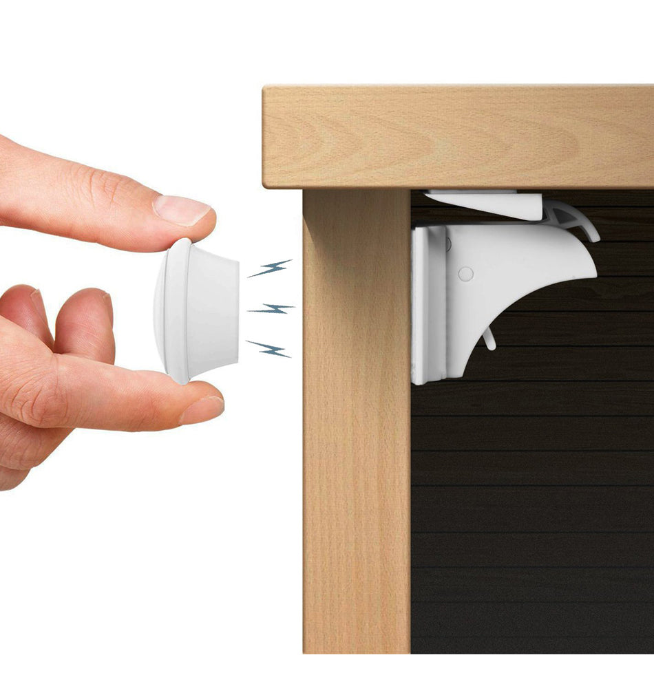 Magnetic key beside an interior cabinet lock in a cutaway view
