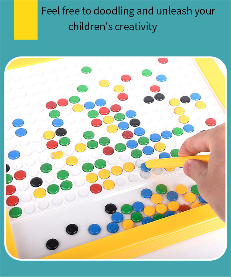 Hand using a magnetic pen to move colored beads across the drawing board