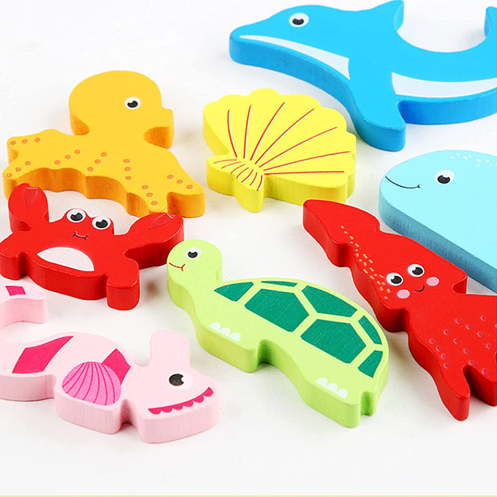 Chunky marine-themed puzzle pieces with a dolphin, turtle, crab, seahorse, and shell