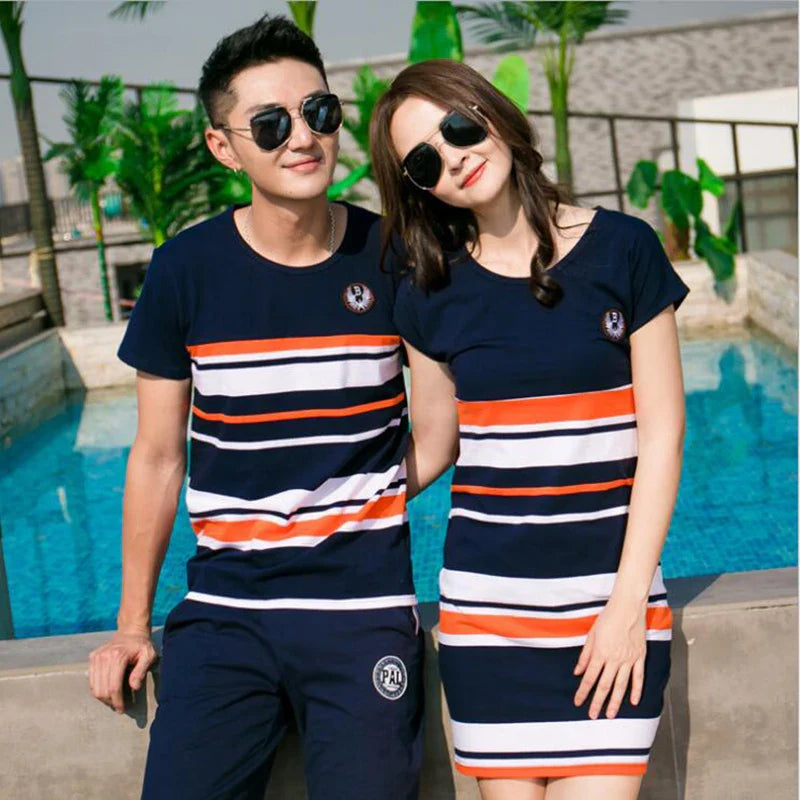 Man and woman wearing a matching striped T-shirt and short-sleeve dress