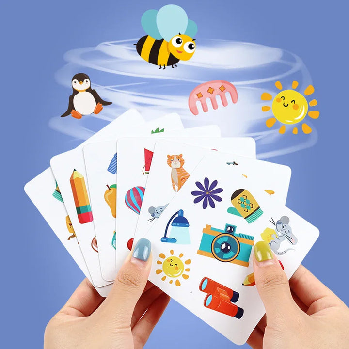 Hands holding picture cards with animals, fruit and everyday objects