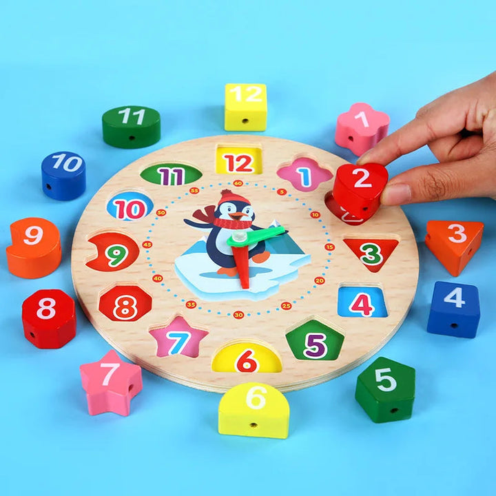 Hand matching a red number 2 block to its space on the wooden clock