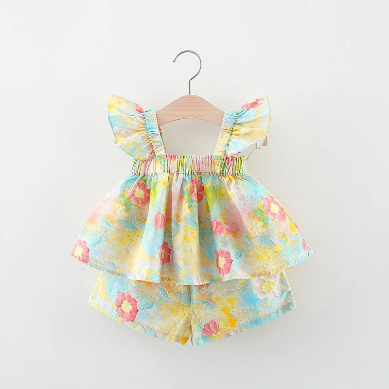 Pastel floral baby outfit with a flutter-sleeve top layered over matching shorts
