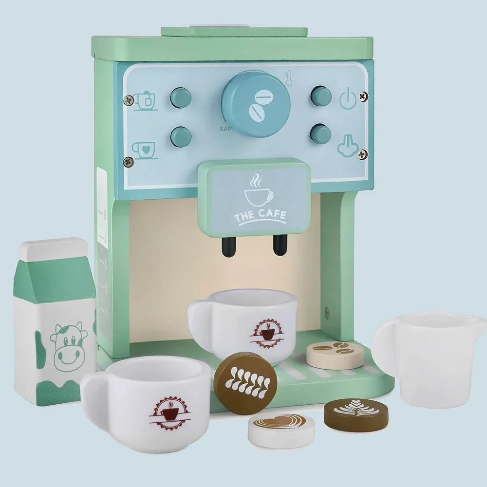 Front view of the toy coffee machine with two cups, a milk jug, a milk carton and coffee-patterned discs
