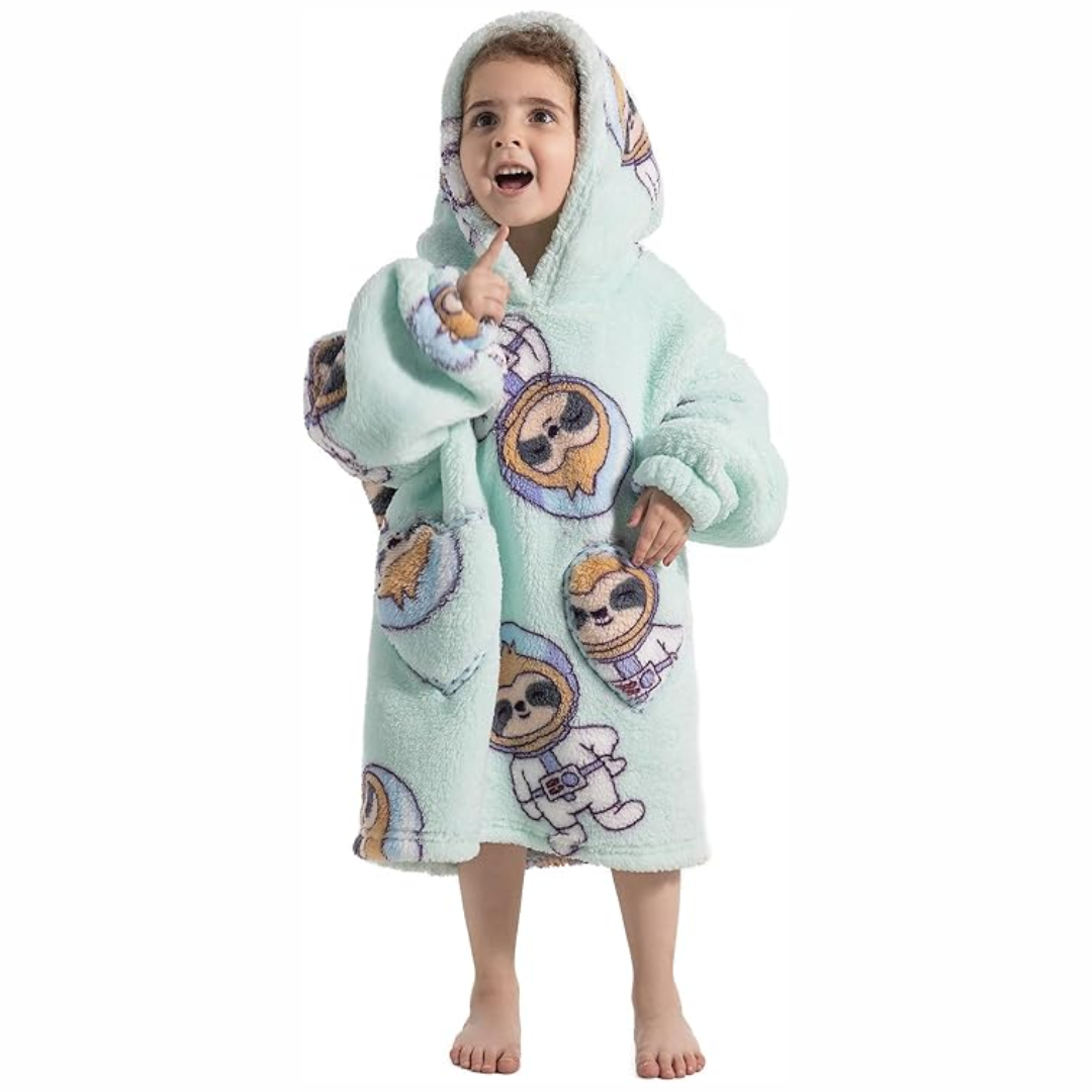 Child wearing a mint green space sloth-print hooded blanket