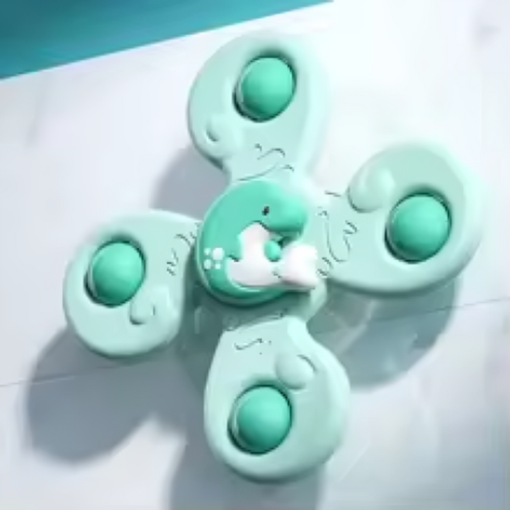 Mint four-arm animal spinner with round green details attached to a tiled surface