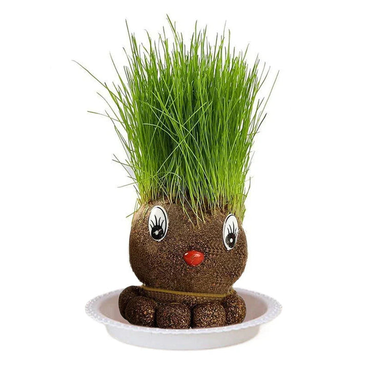 Mole-style growing figure with upright grass, large eyes, and a red nose in a white bowl