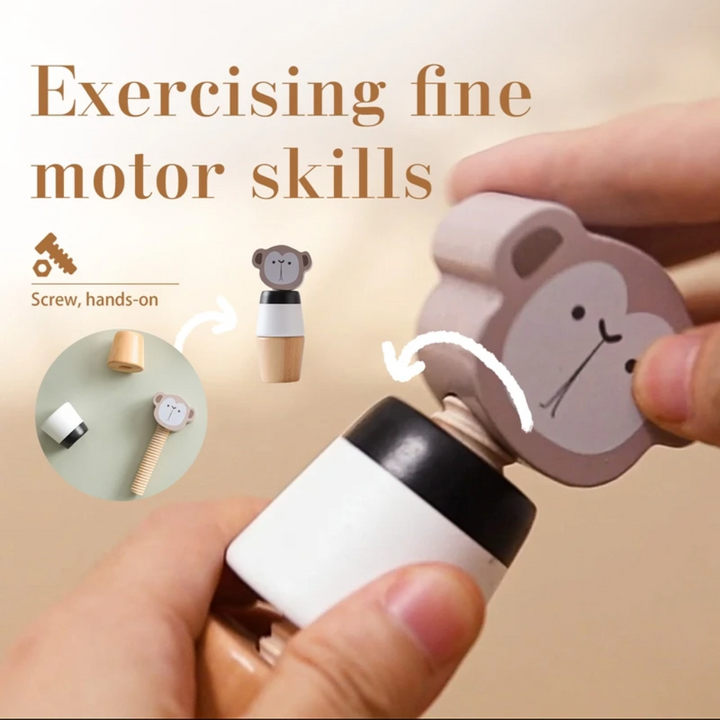 Hands turning the monkey head on a wooden screw-together stacking toy