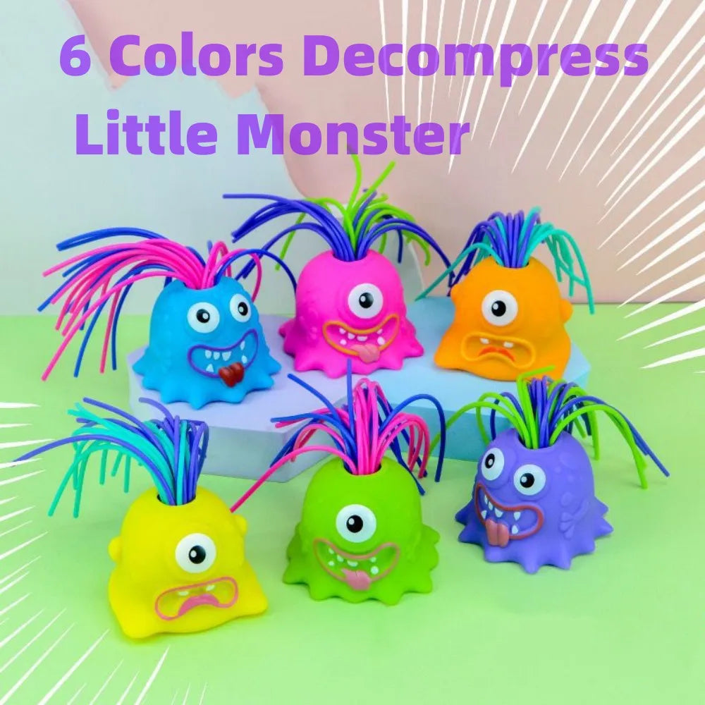 Blue, pink, orange, yellow, green, and purple monster stress toys shown together