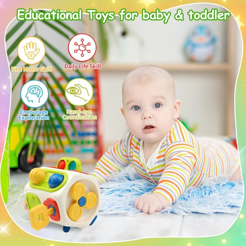 Baby lying on a play mat beside the multicolor activity cube