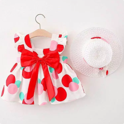 Multicolor polka-dot dress with a red bow and white straw hat