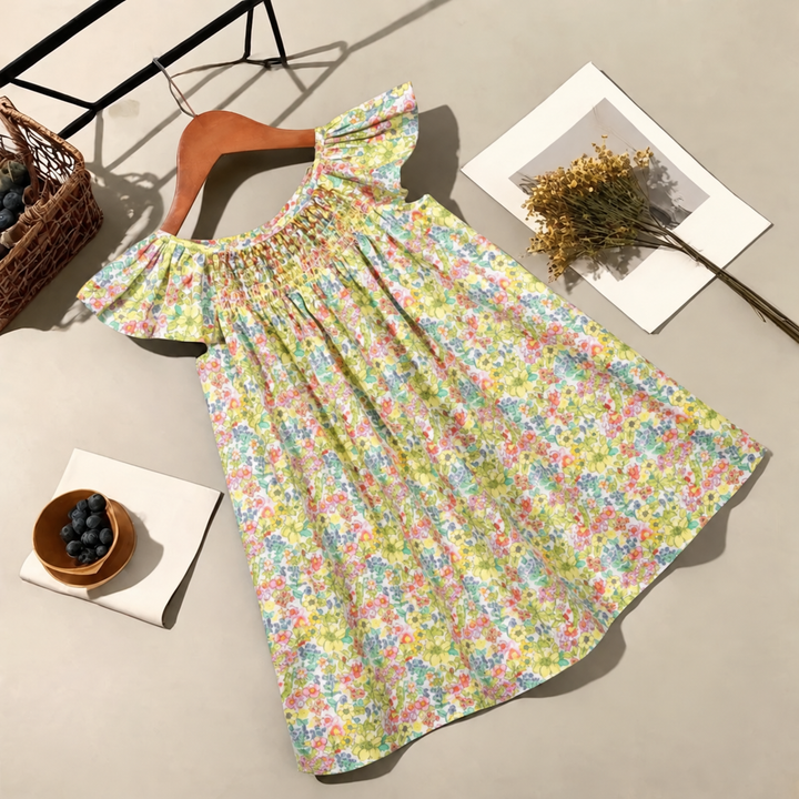 Multicolor floral dress on a hanger, showing flutter sleeves and a full A-line skirt.