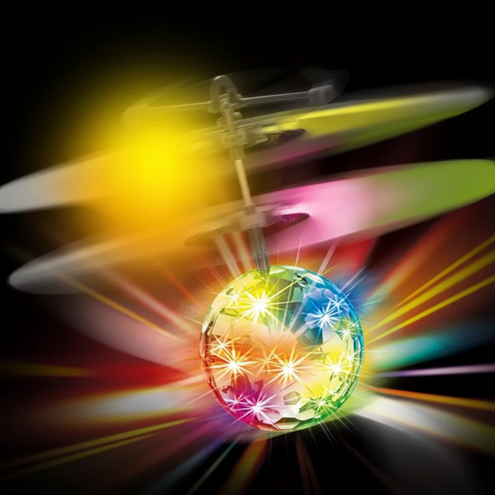 Multicolor LED flying ball shown with spinning white rotor blades