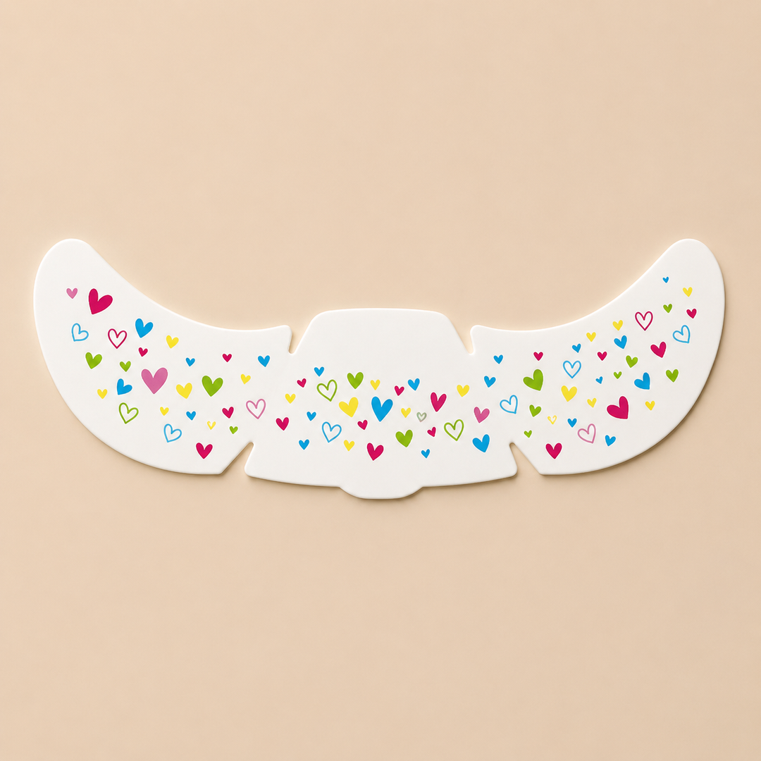 Temporary face sticker sheet with small multicolored heart patterns