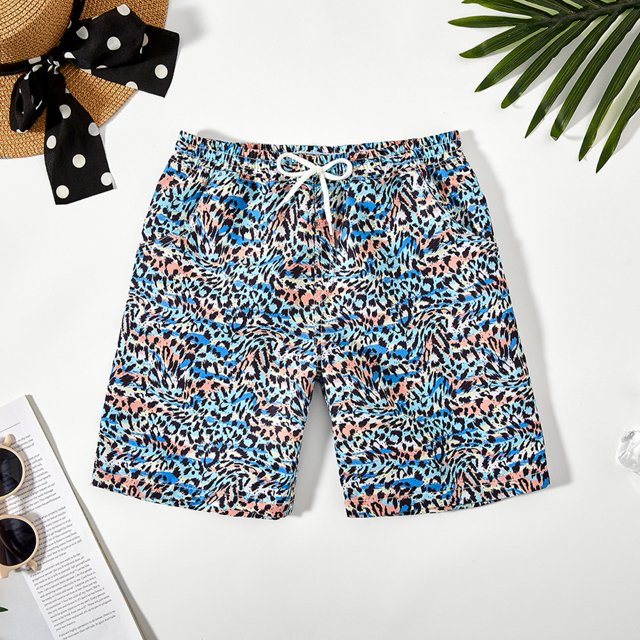 Multicolored leopard-print swim trunks with a white drawstring.