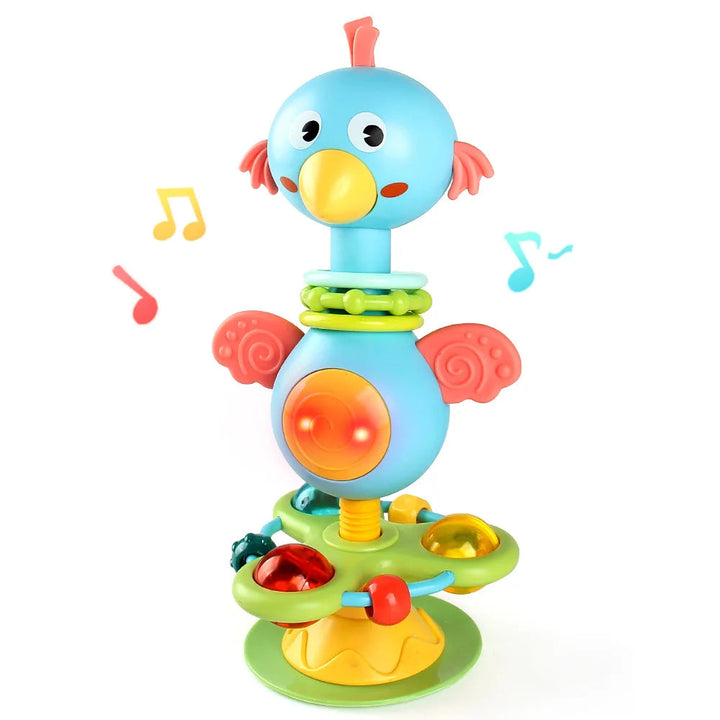 Blue bird rattle with musical-note graphics, colorful play pieces, and a suction cup base