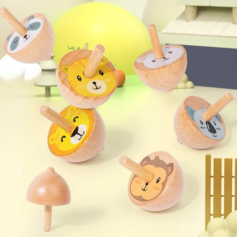 Natural wood animal spinning tops showing illustrated faces and rounded bodies