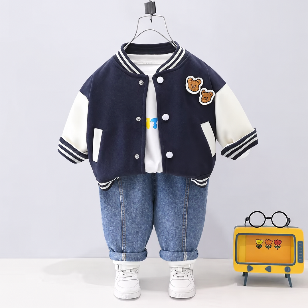 Navy-and-white varsity jacket with bear patches, a white T-shirt, and blue jeans