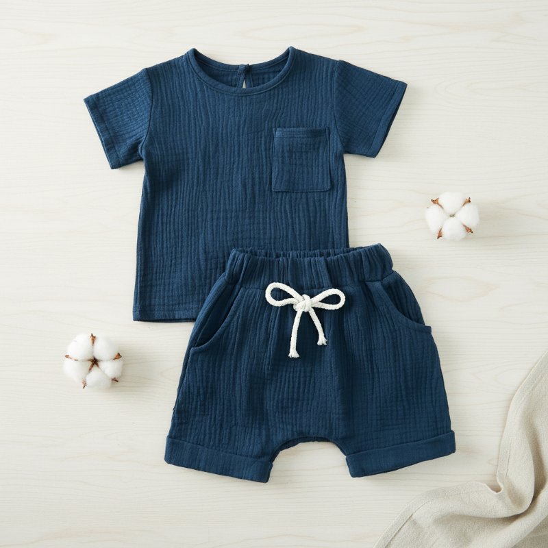 Navy blue cotton T-shirt with a chest pocket and matching elastic-waist shorts.
