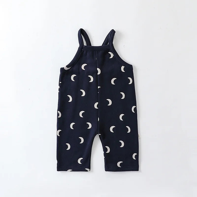Navy baby overalls with light crescent moons and sleeveless shoulder straps