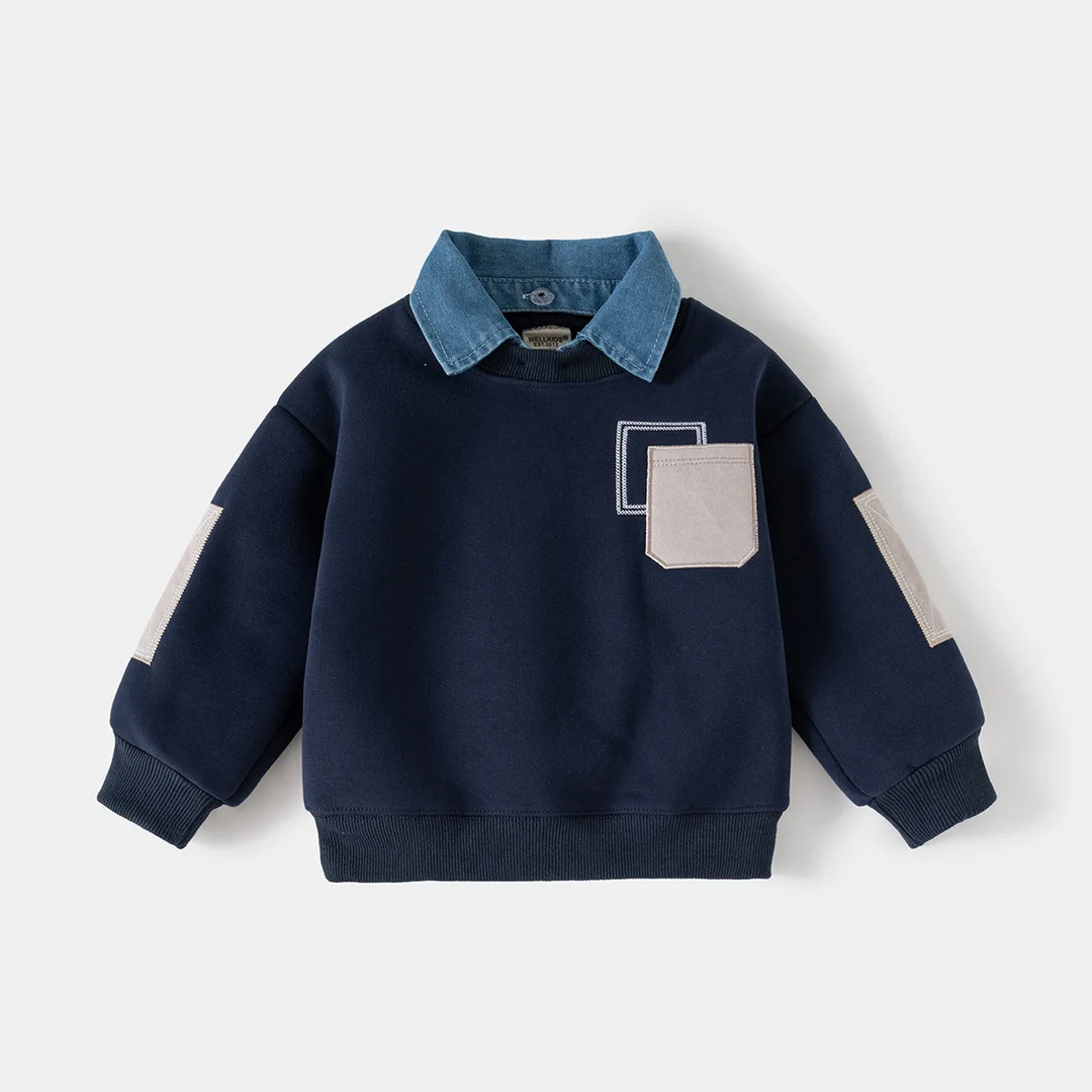 Navy pullover sweater with a denim shirt collar and light contrasting pocket and sleeve patches
