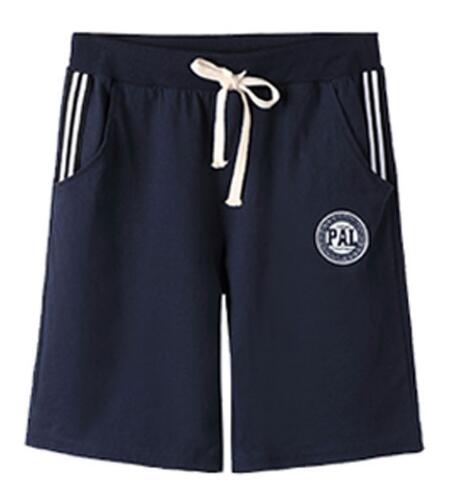 Navy drawstring shorts with white pocket stripes and a round leg emblem