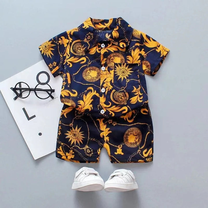 Navy button-front shirt and matching shorts with gold sun and ornamental motifs