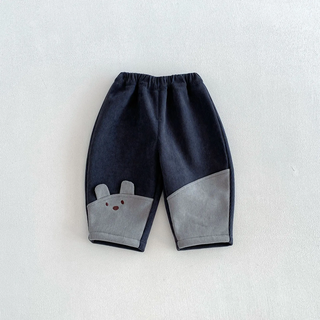 Navy and gray pants with an elastic waistband and animal-face detail near the hem
