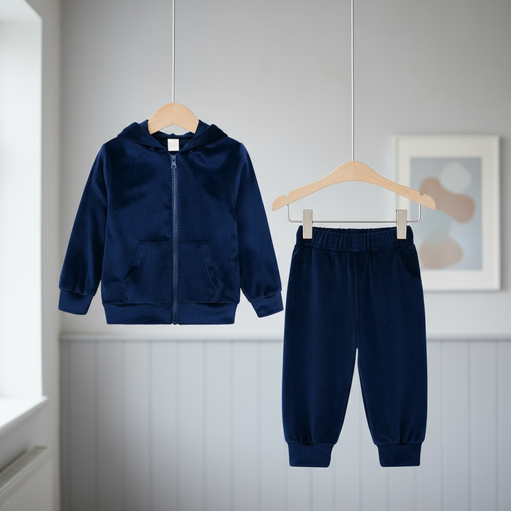 Navy hooded zip-up jacket and matching cuffed joggers hanging side by side