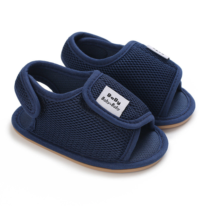 Navy mesh baby sandals with open toes and adjustable hook-and-loop straps