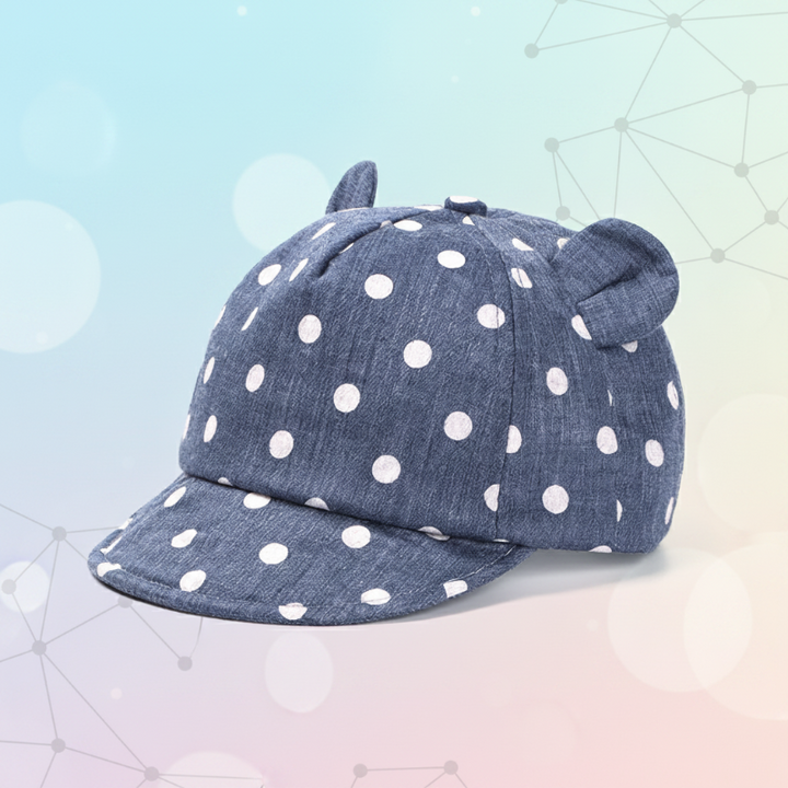 Navy cap with white polka dots, rounded ears, and a curved brim.