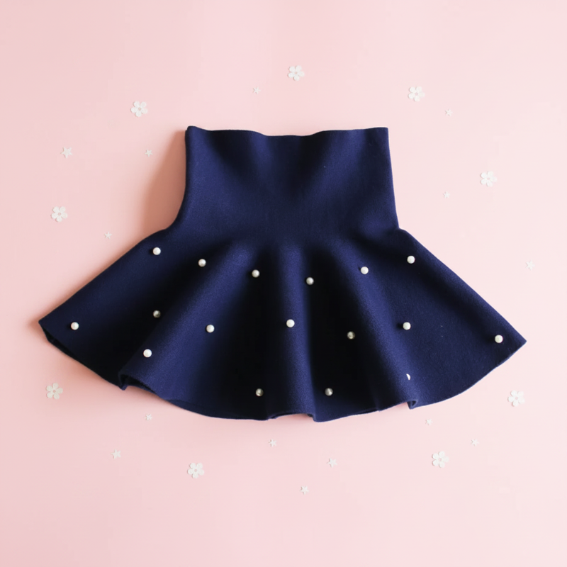 Navy blue flared knit skirt with scattered pearl-style beads