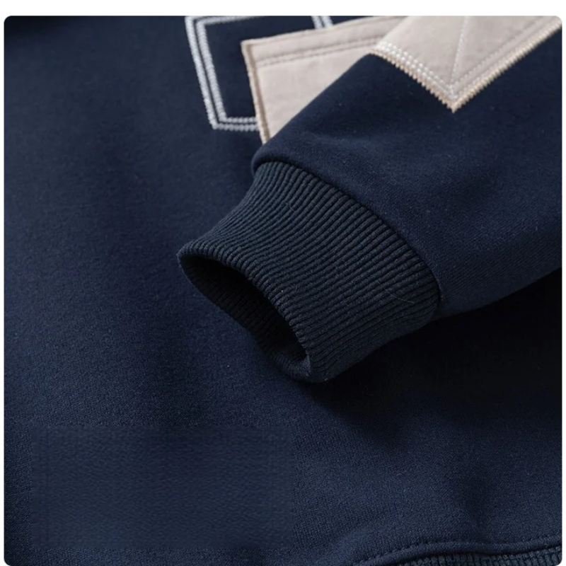 Ribbed cuff and contrasting sleeve patch on the navy boys&