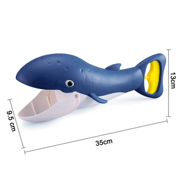 Navy whale-shaped sand grabber measuring 35 x 13 x 9.5 cm