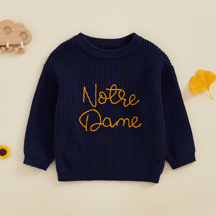 Front view of the navy blue crewneck sweater with yellow embroidered lettering.