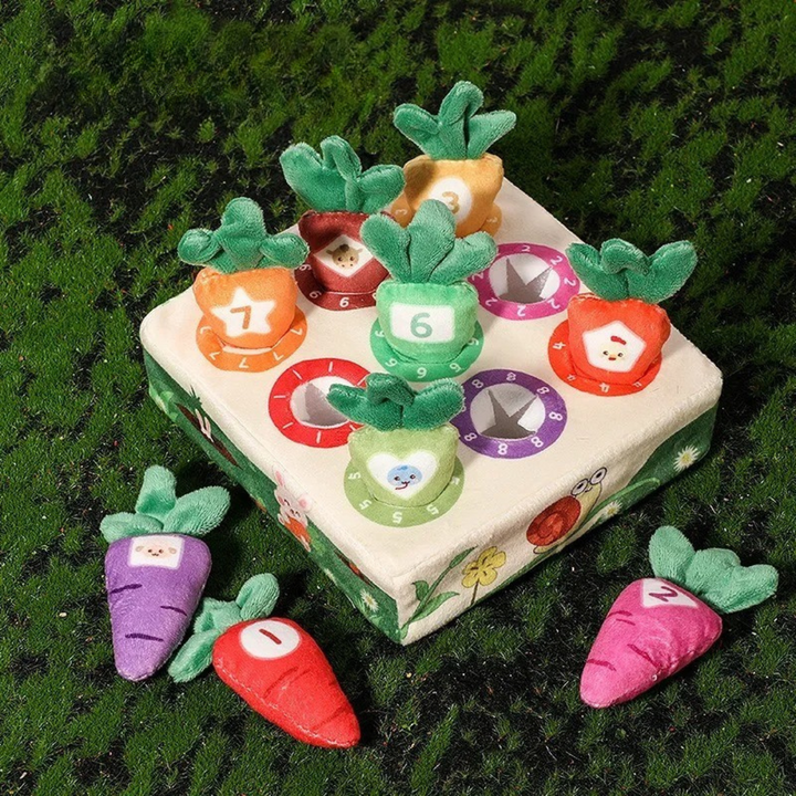 Nine numbered plush carrots displayed in and around a square garden board