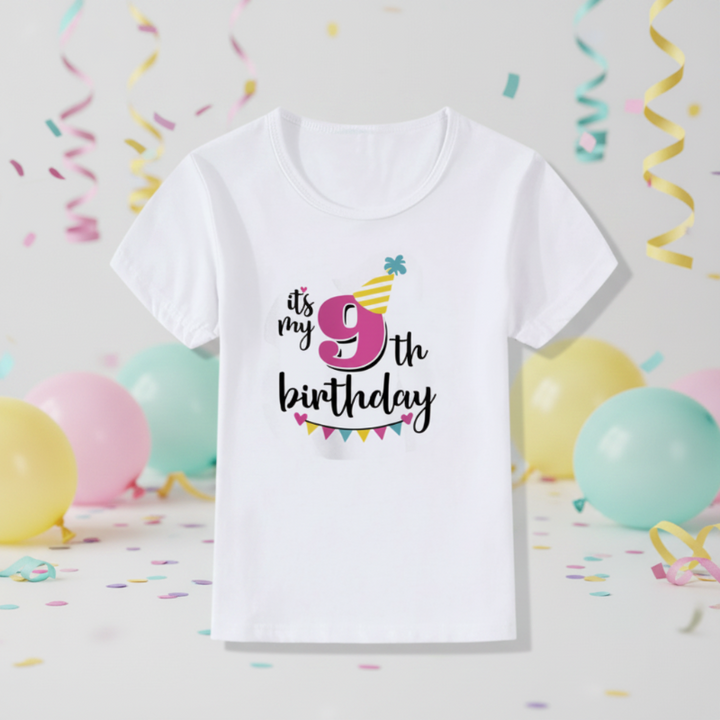 White ninth-birthday T-shirt with a pink number 9, yellow party hat, and colorful bunting