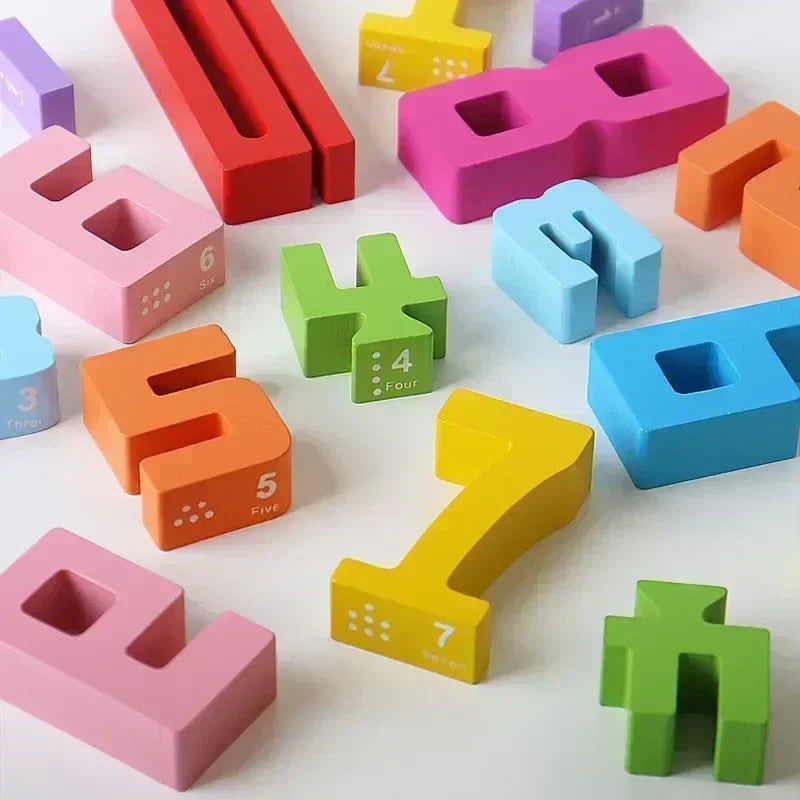 Close-up of number-shaped wooden blocks with printed dots and number words.