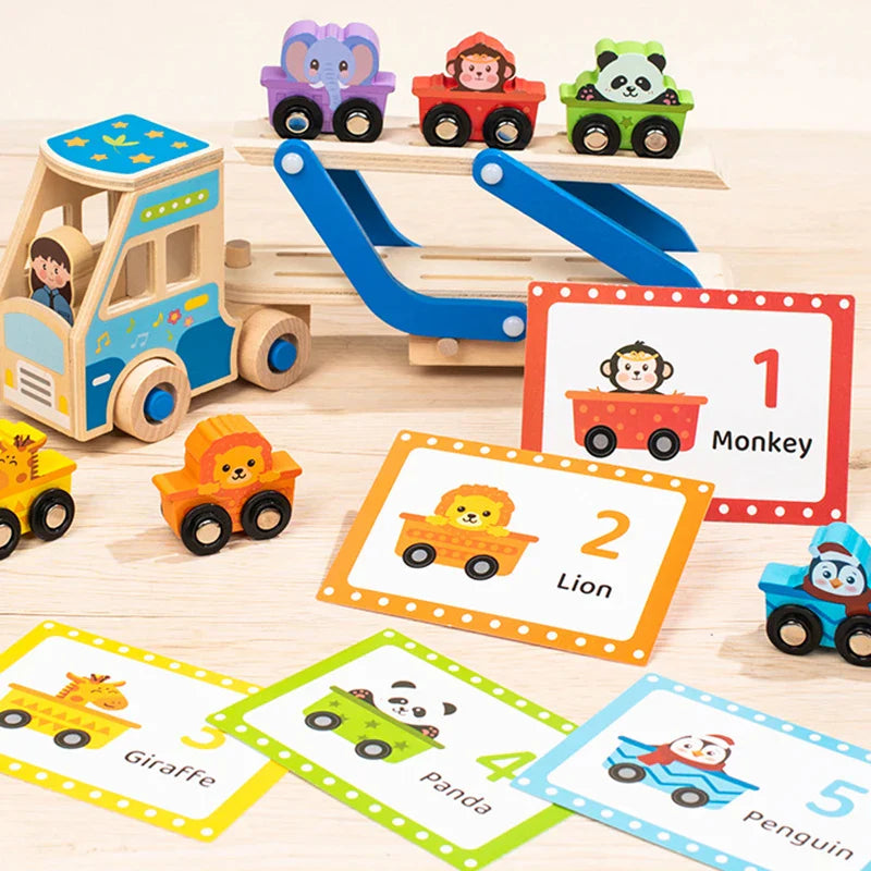 Animal vehicles on a blue wooden carrier truck beside numbered animal matching cards.