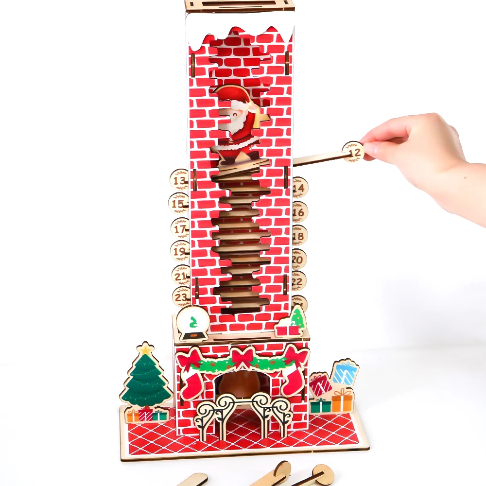 Hand pulling a numbered wooden piece from the chimney countdown calendar