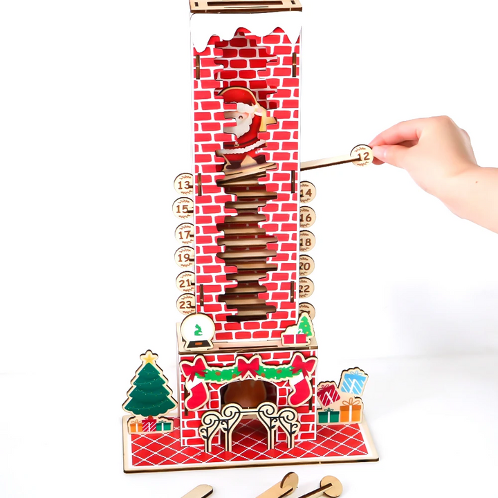 Hand pulling a numbered wooden piece from the chimney countdown calendar