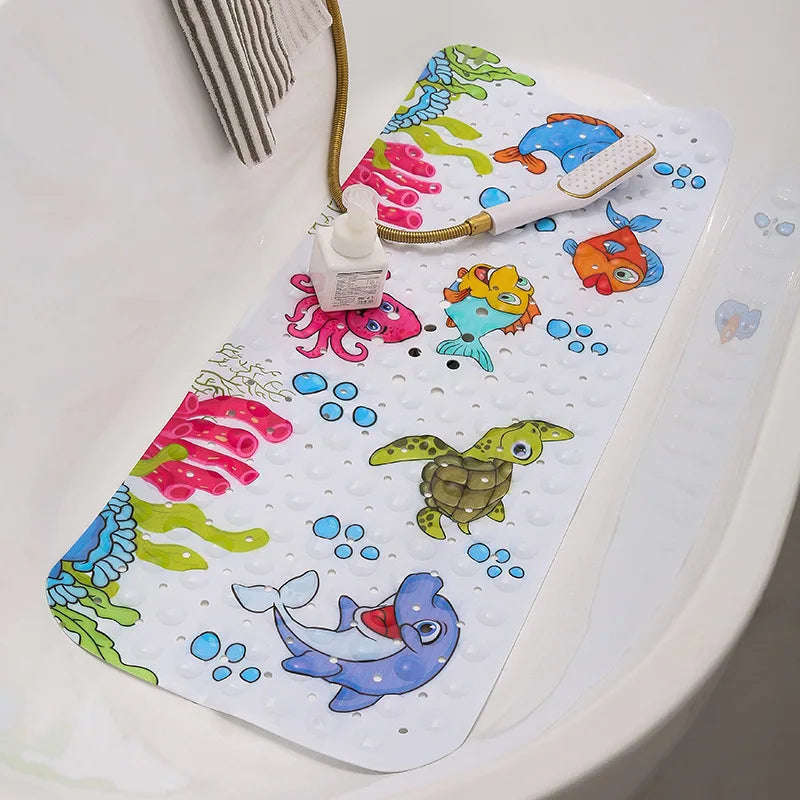 Sea creature bath mat lining a bathtub with a handheld showerhead resting on it