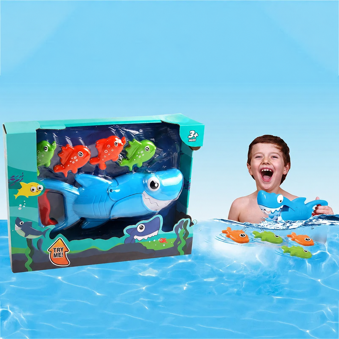 Boxed blue shark and colorful fish bath toy set beside a child playing in water