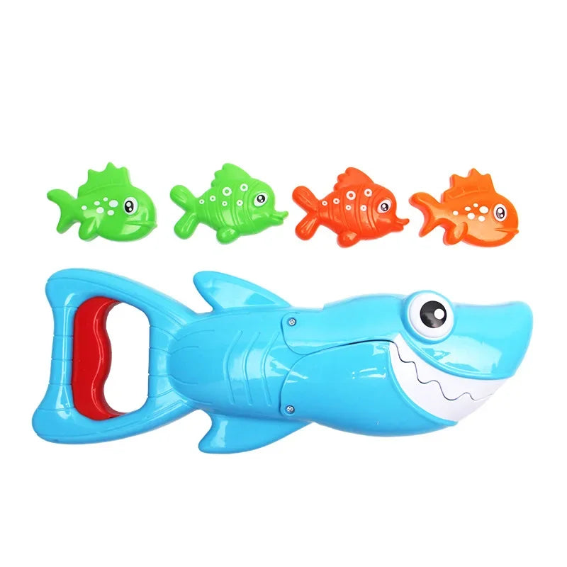 Blue shark bath toy with a red handle lever and four green and orange fish