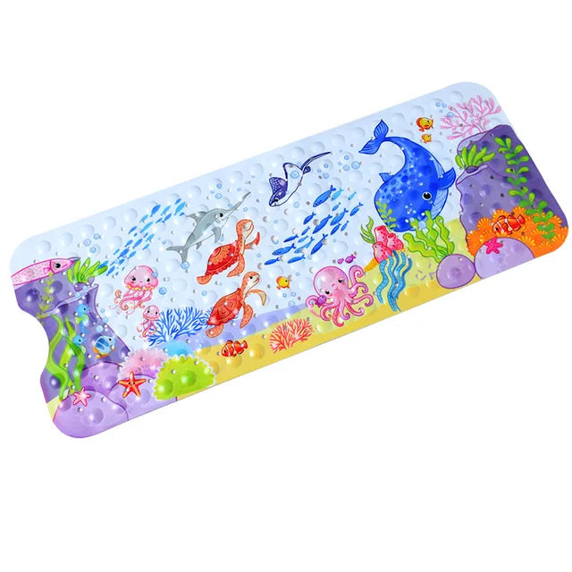 Ocean-themed bath mat with a blue whale, jellyfish, coral, and colorful sea creatures