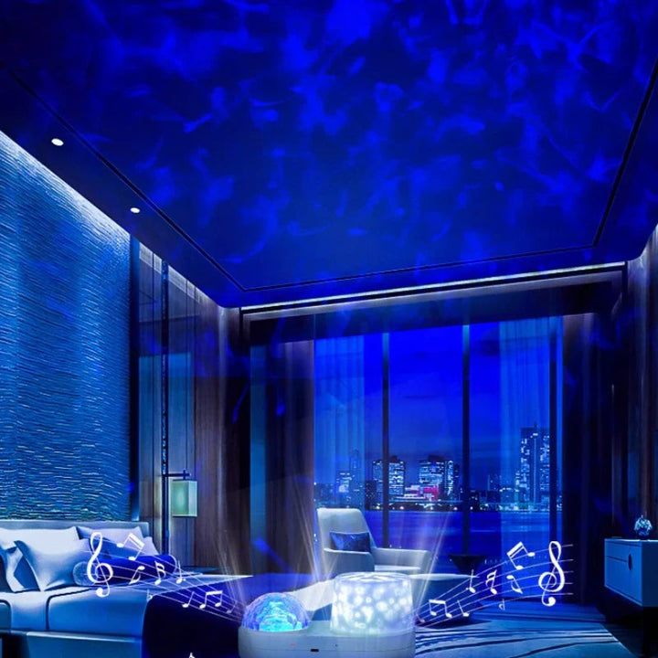 Blue ocean-wave lighting across a living room ceiling, with the projector on a table.